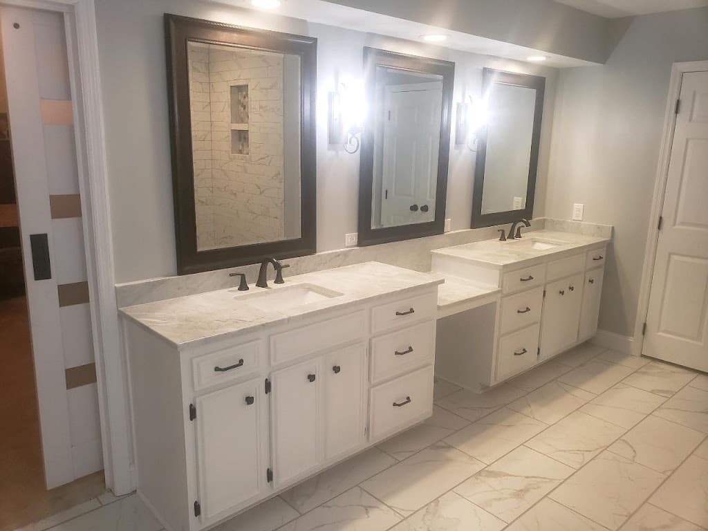 Finished double-vanity bathroom remodel with marble tile flooring